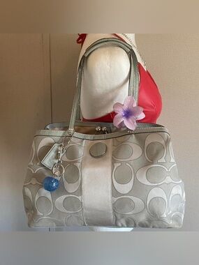 Gray and silver Coach purse with silver hardware